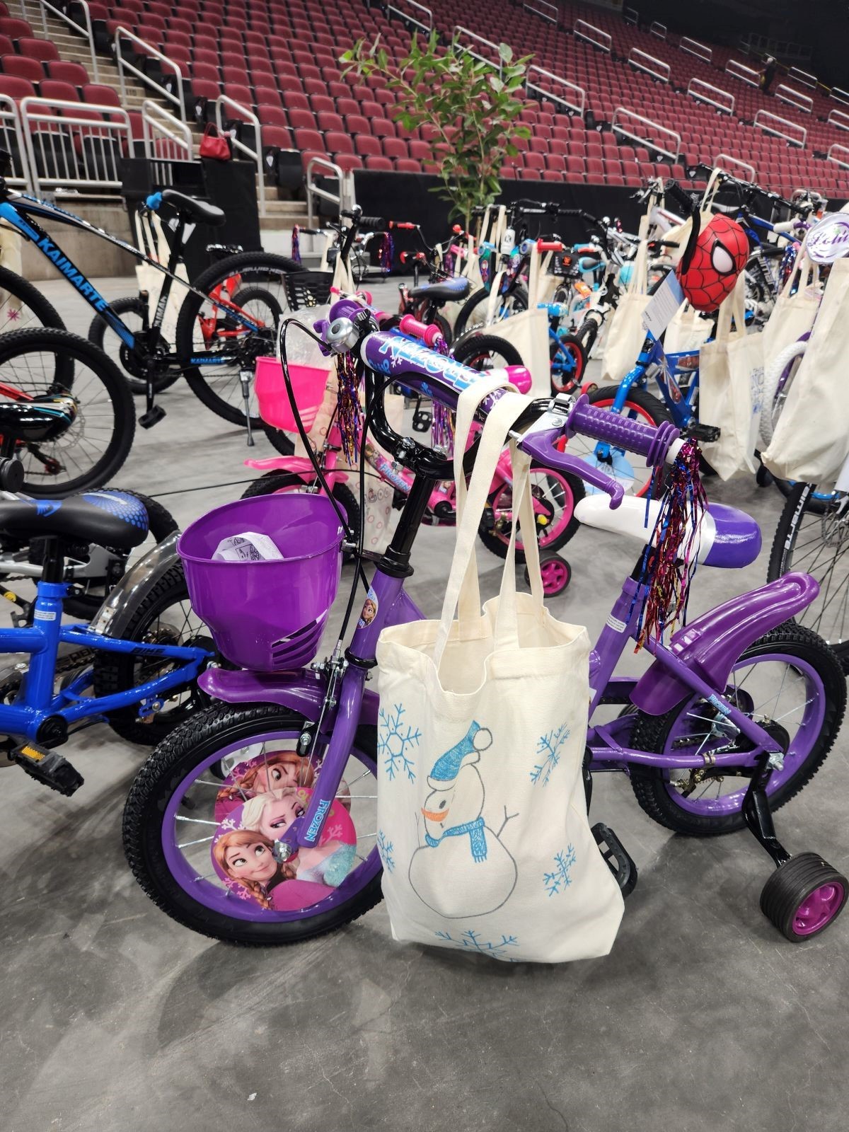 giving tree 2024 bike build event with a close up photo of a girl's bike and other bikes in the background