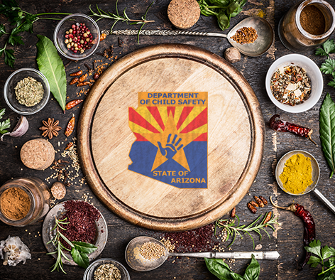 Photo of DCS logo on cutting board surrounded by food